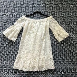 Likely off white off the shoulder lace dress